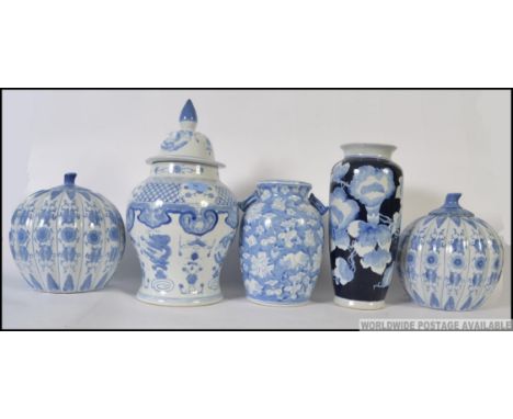 A pair of 20th century Chinese blue and white ginger jars of pumpkin form complete with lids. Together with a Chinese blue an