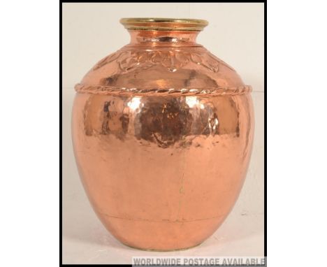 A very large 20th century heavy unusual hand beaten Arts and Crafts style copper / brass vase copper vase / planter  / stick 