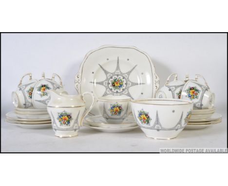 A Wetley Staffordshire porcelain chintz pattern part tea service comprising cups, saucers, plates etc