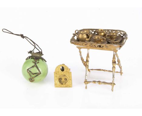 A German soft-metal dolls’ house butler’s tray on stand, painted gold, pierced decoration and tea set for three —2 3/4in. (7c