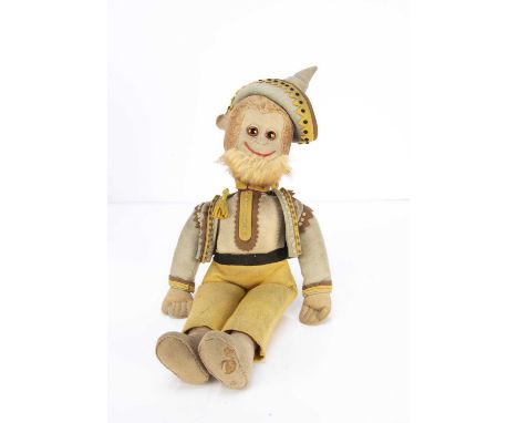 A well made cotton plush and felt Mexican monkey probably from an Edith Moody pattern,  with orange and black glass eyes, bro
