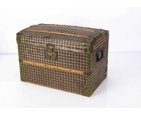 An early 20th century  domed dolls’ cabin trunk, with black, brown and white patterned oil-cloth, wooden bands held with bras