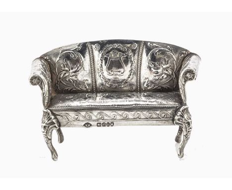 A Continental silver dolls’ house neoclassical sofa with Foreign London import marks 1900, the three seater with lyre and scr