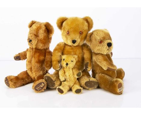 Four post-war British Teddy Bears,  a Merrythought Winnie the Pooh with label —13in. (33cm.) high (missing t-shirt); one prob