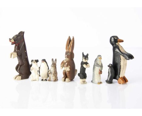 Pip Squeak and Wilfred toy figures, a painted carved wooden set —4in. (10cm.) high; a moulded glass Squeak (missing paste eye