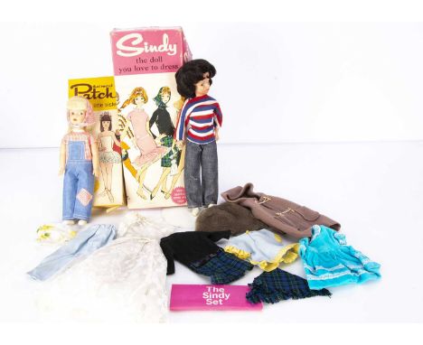 A Pedigree Hong Kong Mini Sindy doll circa 1965, with blue side glaring eyes and brunette bubble-cut with fringe, in Weekende