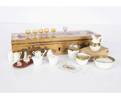 Dolls’ house chattels, a porcelain wash set with jug, basin, chamber pot and slop bucket with gold rim —1 1/2in. (4cm.) heigh