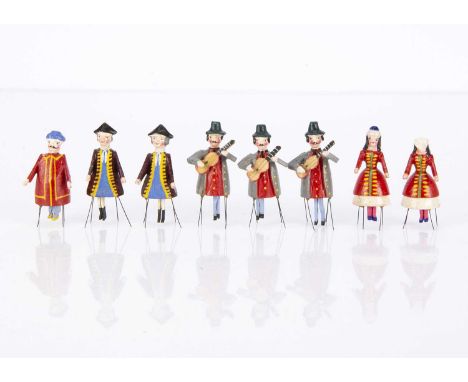 Eight 19th century German dancing bristle toys, three men playing guitars —2 1/2in. (6.5cm.) high, a Chinaman, two men in bi-