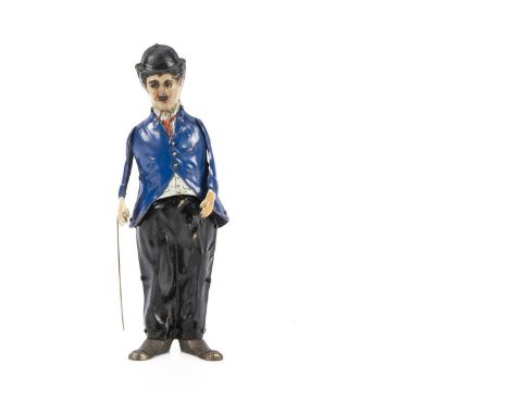 A rare B &amp; R New Jersey (USA) clockwork lithographed tinplate Charlie Chaplin circa 1915,  with hinged arms with cane, ar