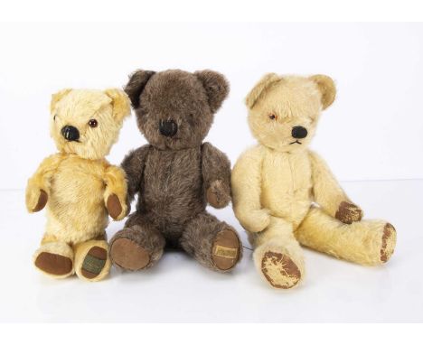 Three post-war British Teddy Bears,  a Chad Valley teddy bear with light golden mohair, orange and black plastic eyes, black 