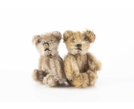 Two post-war Schuco miniature Teddy Bears, one with light brown mohair, black pin eyes, black stitched nose and mouth and met
