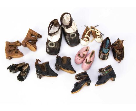 Doll’s shoes, the largest pair of brown leather stamped B or R —3 1/2in. (9cm.) long, a fashion doll’s pair of brown leather 