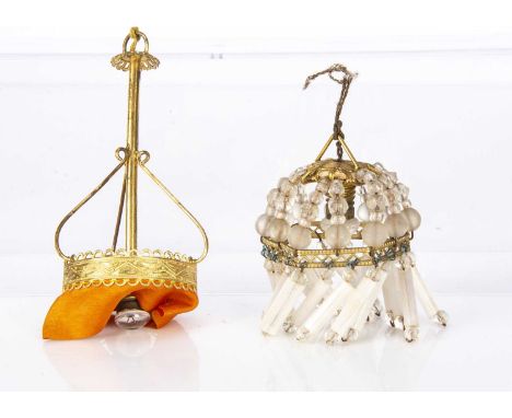 Two German gilt metal dolls’ house electric ceiling light fittings, a glass bead chandelier —3in. (7.5cm.) high; and a long s