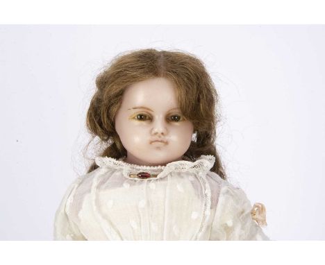 A mid 19th century Montanari poured wax child doll, the shoulder-head turned slightly to the left, inset brown glass eyes, do