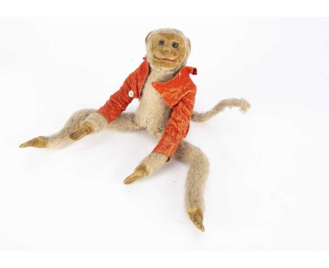 A Norah Wellings Monkey 1930s, with brown velvet face, ears and hands, inset glass eyes, swivel head, light brown wool plush,