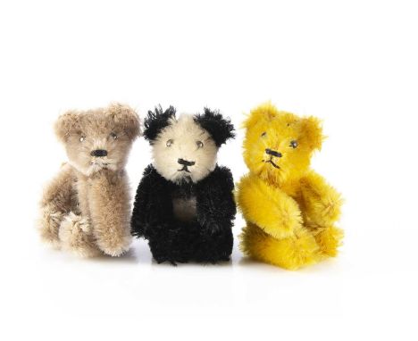 Three post-war Schuco miniature Teddy Bears, comprising of panda bear, light brown mohair bear and a golden mohair example, a