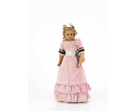 A mid 19th century Montanari poured wax child doll, the shoulder-head turned slightly to the right, inset blue striated glass