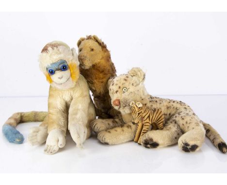 Steiff wild animals, a 1930s seated lion with clear and black glass eyes with brown backs and brown tipped mane —10 1/2in. (2