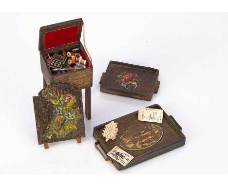Pit-a-Pat wooden dolls’ house accessories, a firescreen —2in. (5cm.) high and tray, both with flower transfers, a larger tray