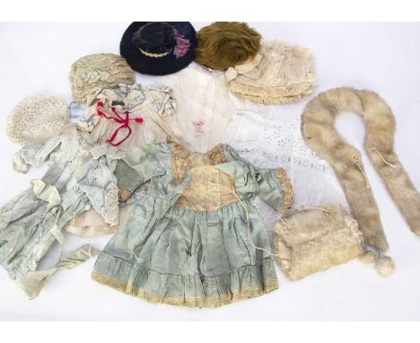 Good quality doll’s clothing, a white mohair stole with pom-poms —9 1/2in. (24cm.) long from shoulder to base; a matching muf