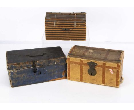 Three doll’s trunks,  an early trunk covered in blue/black paper and interior covered with pages from a book —10in. (25.5cm.)