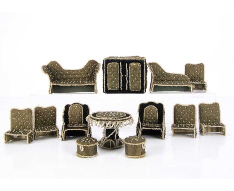 A late 19th century dolls’ house upholstered card and beadwork drawing room set, comprising sofa —5in. (12.5cm.) wide, two ar