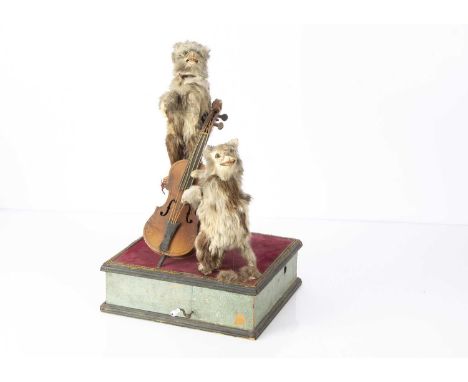 A French manivelle musical cat automaton late 19th century, with two rabbit fur covered carton cats with glass eyes and whisk