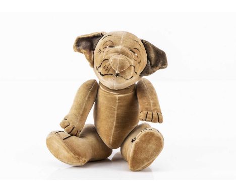 A Chad Valley George Studdy’s Bonzo the dog 1920s, of cream velvet, painted features, swivel head, jointed limbs with black s