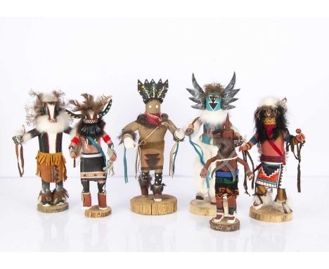 Six Native American carved wooden figures,  including Badger by CC —11in. (28cm.) high; Angry Face and Apache Crown Dance by 