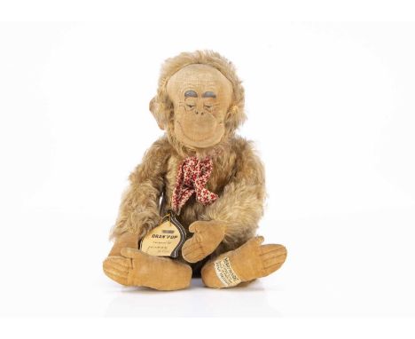 A Merrythought Lawson Wood Gran-pop chimpanzee soft toy late 1930s, with golden mohair, pressed velvet face with painted and 