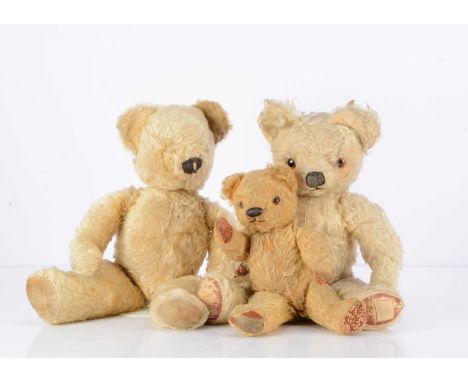 Three post-war Chad Valley Teddy Bears,  ia blonde mohair bear with orange and black plastic eyes, black stitched nose and mo