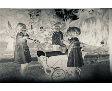 Twenty-six Norah Wellings family photograph negatives, including children playing, views, a Scottish Terrier and garden views