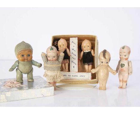 Two English bisque Fumsups,  both with jointed arms and heart shaped labels —4 1/2in. (11.5cm.) high; a composition baby in b