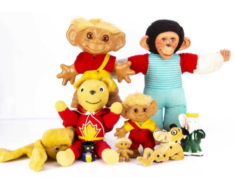 A large Thomas Dam rubber Troll doll,  in red and yellow felt outfit —12in. (30cm.) high and a smaller similar example; a Dia