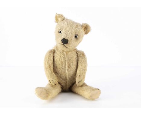A 1930's Chiltern type Teddy Bear, with blonde mohair, clear and black glass eyes with the remains of brown painted backs, bl