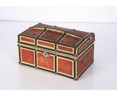 A small late 19th century doll’s domed trunk, with red, white and black embossed paper details and brass studs —9in. (23cm.) 