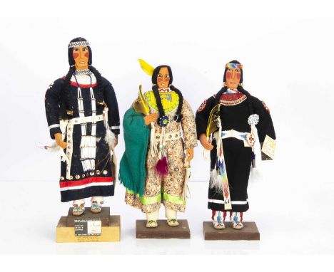 Three Native American Indian Oglala Sioux squaw figures by Zelda Fast Horse, carved wooden heads and hands, beaded clothes, o