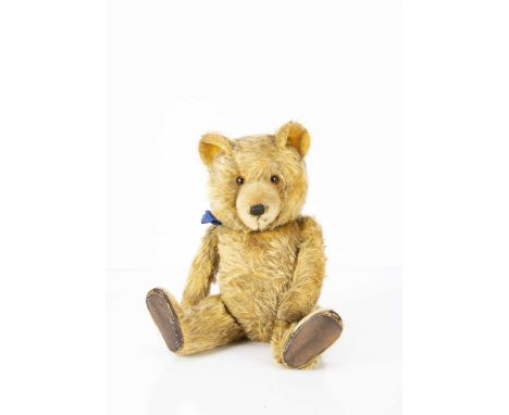 An unusual post-war Chiltern Ting-a-Ling musical Teddy Bear,  with golden mohair, orange and black glass eyes, pronounced sho