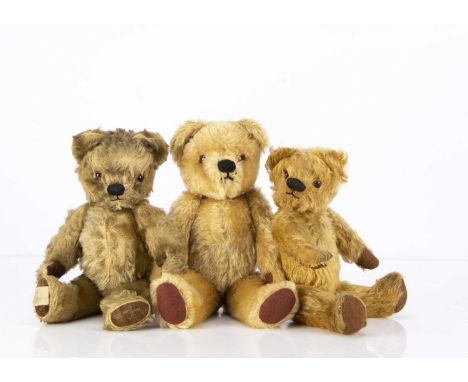 Three post-war Chad Valley Teddy Bears,  comprising a blonde mohair with orange and black glass eyes, black stitched nose, an
