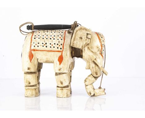 A Mayanmar carved wooden elephant puppet, painted white with red and black dots for luck —11 3/4in. (30cm.) long, 1960s