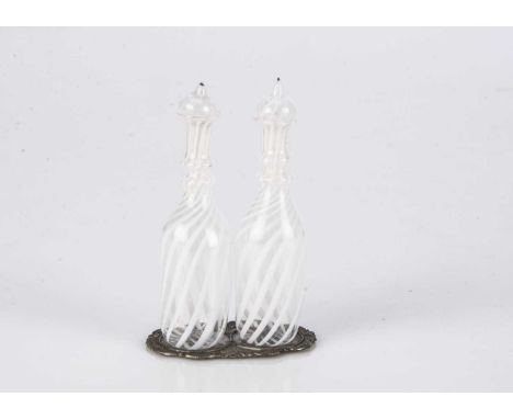 A pair of large scale dolls’ house or doll latticino glass decanters,  clear and white glass with stoppers and metal stand —3