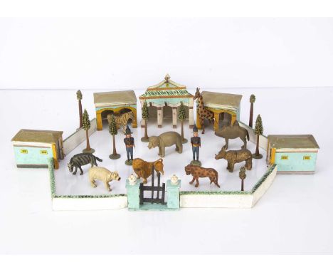 A rare German mid 19th century wooden menagerie,  comprising a three stall main building painted in turquoise with scrolling 