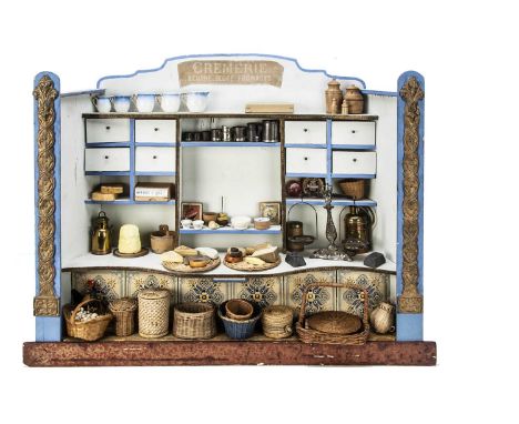 A French late 19th century Cremerie shop, painted light blue and blue wood with ornate gilt decorated pillars, paper tiled co