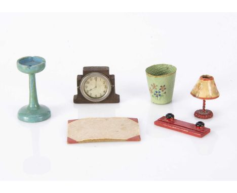 Pit-a-Pat dolls’ house chattels, a red desk set with ink stand and blotting sheet holder, a smoker’s stand —1 3/4in. (4.5cm.)