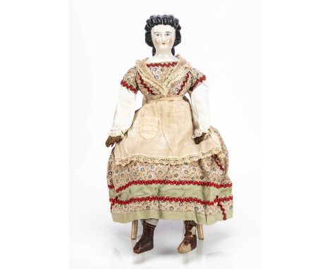 A Conta &amp; Boehme mid 19th century china shoulder head lady doll with elaborate hair, with blue painted upward glancing ey