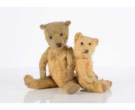 A 1930's Chiltern type Teddy Bear, with golden mohair, replaced boot button eyes, black stitched nose and mouth, swivel head,