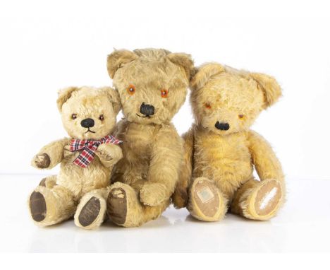 Three post-war Chad Valley Teddy Bears,  a golden mohair bear with orange and black plastic eyes, black stitched nose and mou