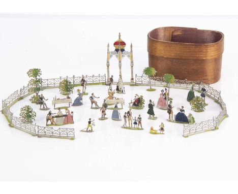 A mid 19th century German ‘flats’ toy Pleasure Garden,  comprising a boy riding hobby horse, a girl pulling a perambulator, a