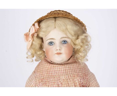 A Kestner turned shoulder head doll,  with fixed striated blue glass eyes, closed mouth, plaster pate with blonde mohair wig,