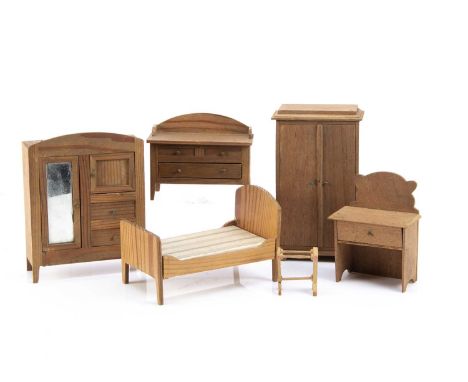 German plain wood dolls’ house furniture, a pitch pine bed -5 3/4in. (14.5cm.) long and a similar wardrobe with mirror; anoth